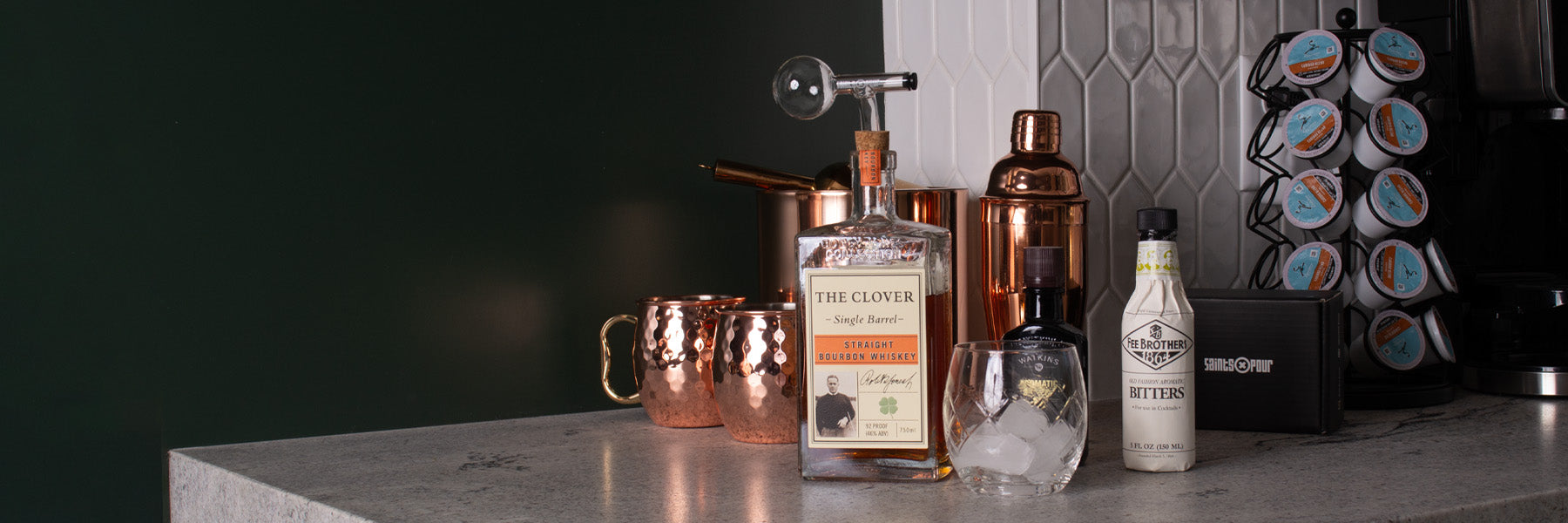 home bar with a bottle of Clover whiskey with a Saints Pour device